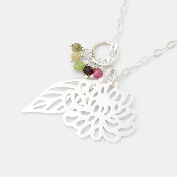 Silver cluster pendant with chrysanthemum and leaf pendants and tourmaline gemstones