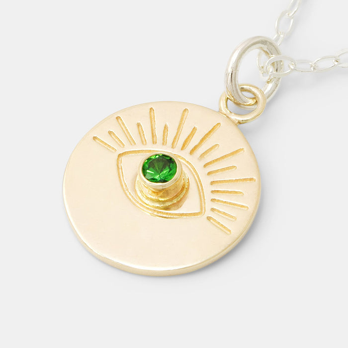 Solid gold pendant necklace with evil eye design and tsavorite gemstone