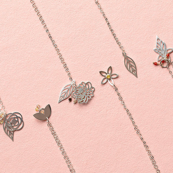Layering necklaces in sterling silver and gold